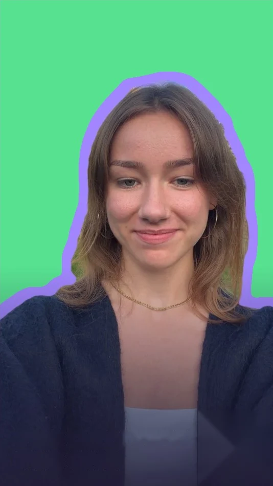 Young woman with long hair in a dark cardigan